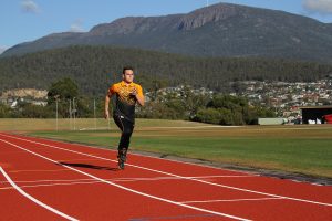 Russel Taib running on track, photo credit: Lilly Castle