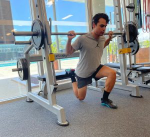 Russel Taib with weights in gym